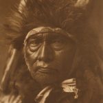 Edward S. Curtis, Bull Chief – Apsaroke, plate 128, 1908, photogravure on Dutch Van Gelder paper, 15 3/4x10 1/4 inches, Gift of the Dubuque Cultural Preservation Committee, an Iowa general partnership consisting of Dr. Darryl K. Mozena, Jeffrey P. Mozena, Mark Falb, Timothy J. Conlon, and Dr. Randall Lengeling, 2009.128