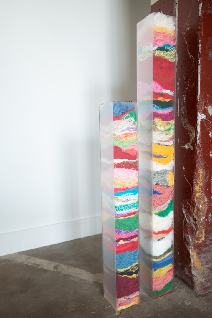 Catherine Reinhart, E.V.R. 03.13.2020 | M.R.R 03.13.2020, 2020, Acrylic pillars and cast-off fibers, 50x10x5 in., Collection of the artist