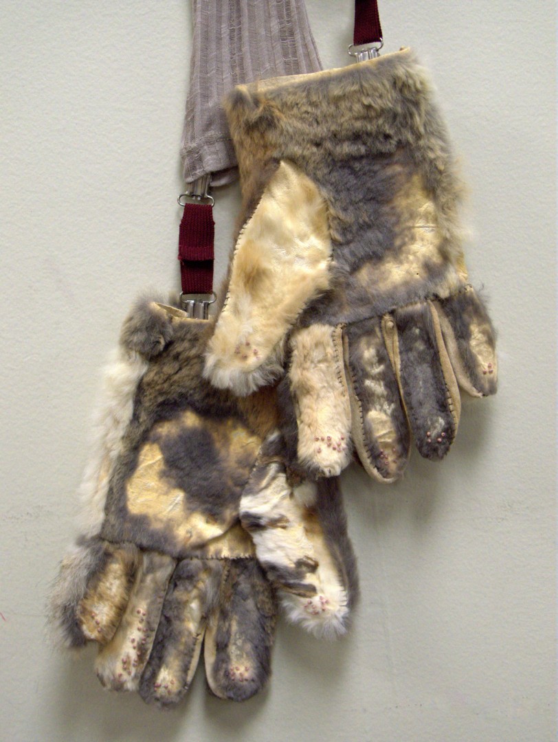 "Hush ( I remember how warm your skin used to be )" from the Braille Series, 2020, 35" x 10" x 2.5", Salvaged vintage rabbit fur glove liners, poly-rayon blend fabric, glove clips, glass beads, Braille text