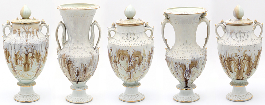 Heart Burial Urn and Vase Garniture. 2021. Cone 10 reduction fired English Porcelain. Wheel thrown with slip trailing, water etching, and gold luster. 11"x6"x5" ea.
