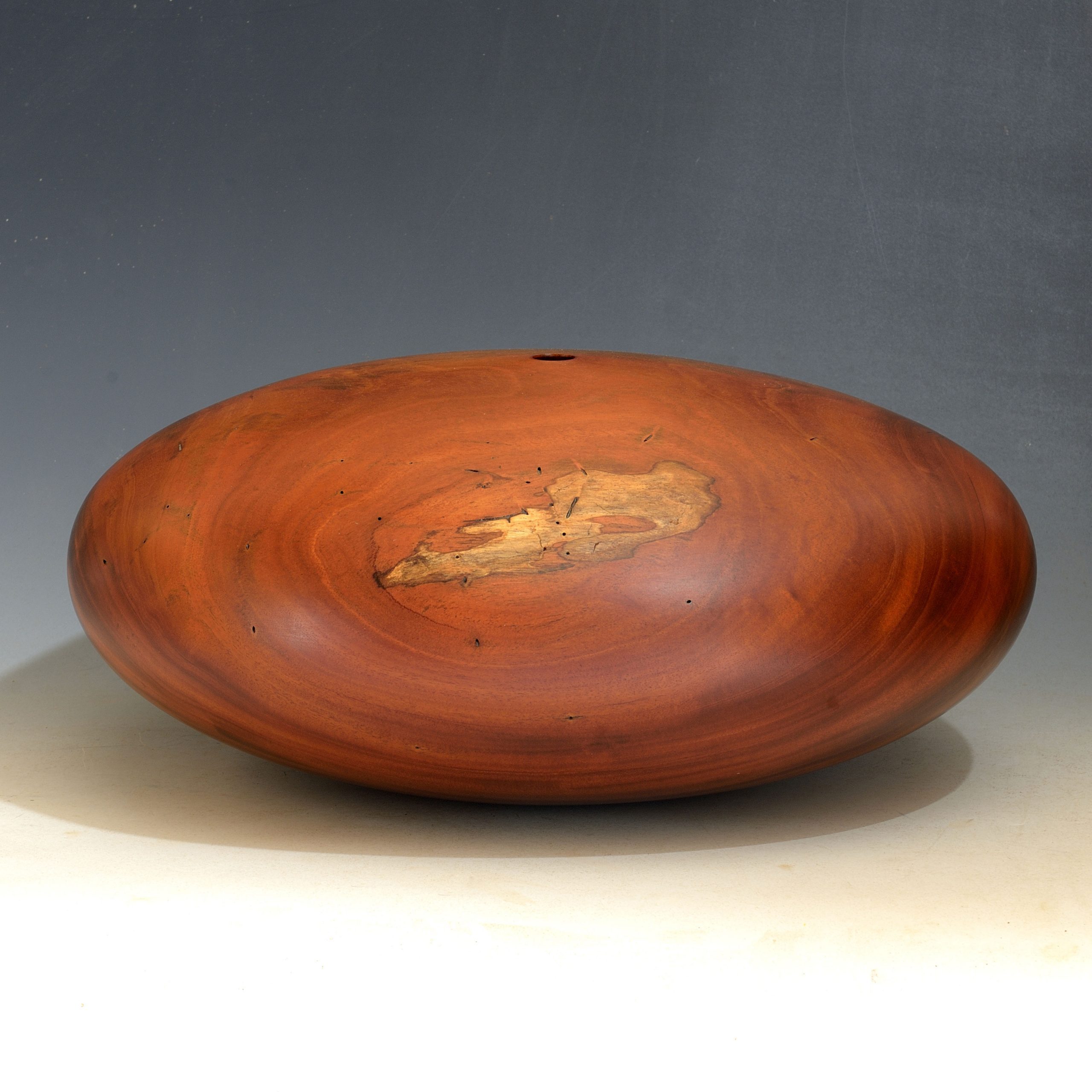 Gordon Browning, Red Desert, 2010, Cuban Mahogany, 6.75x16x16 inches, collection of the artist